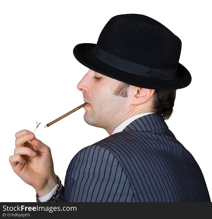 Retro businessman light a cigarette isolated over white with clipping path