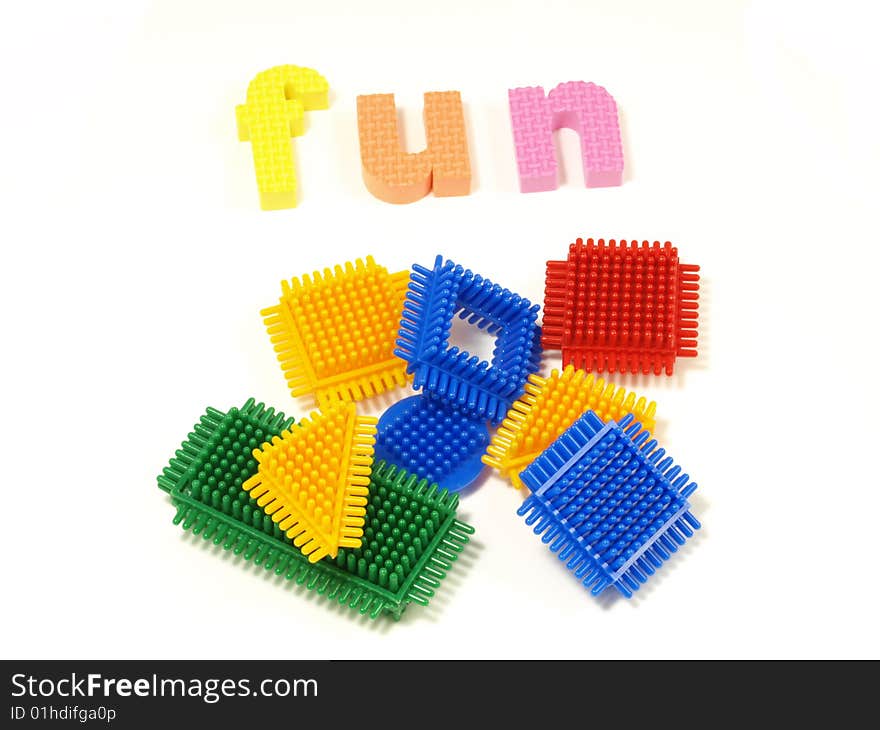 Colorful blocks and foam letters on isolated background. Colorful blocks and foam letters on isolated background.