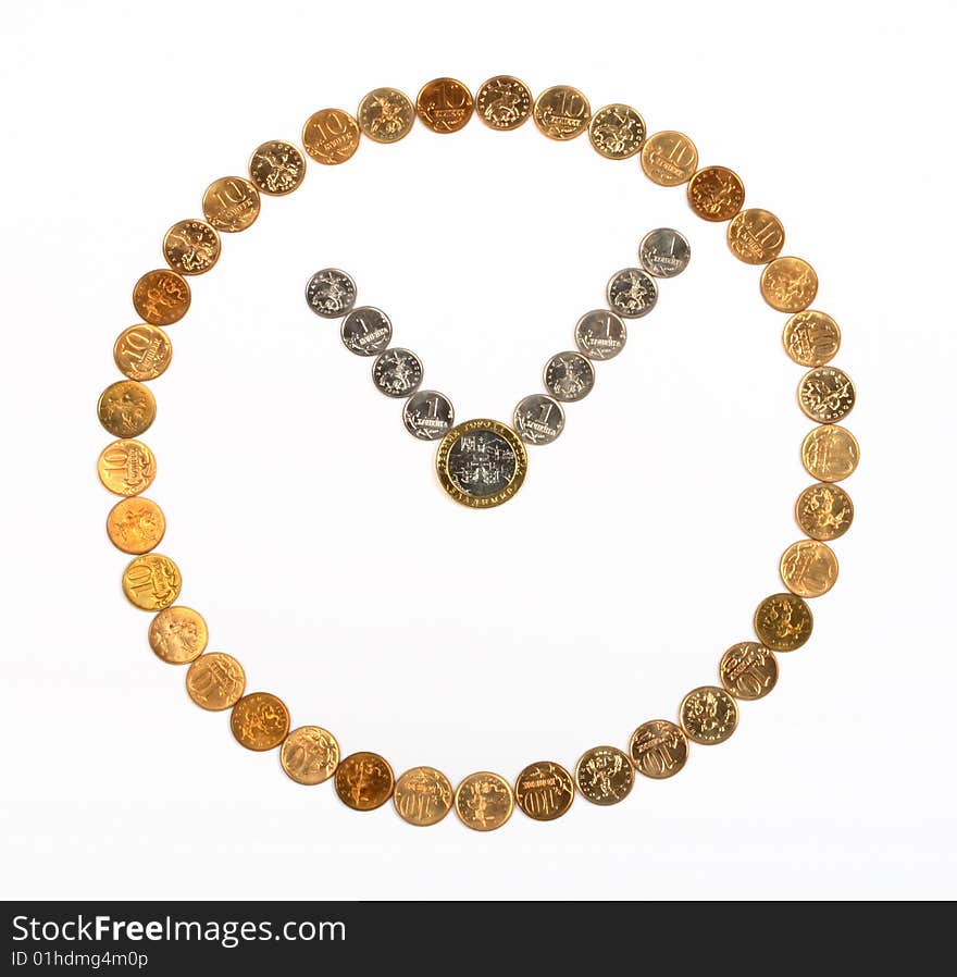 A clock made of coins on the white background. A clock made of coins on the white background