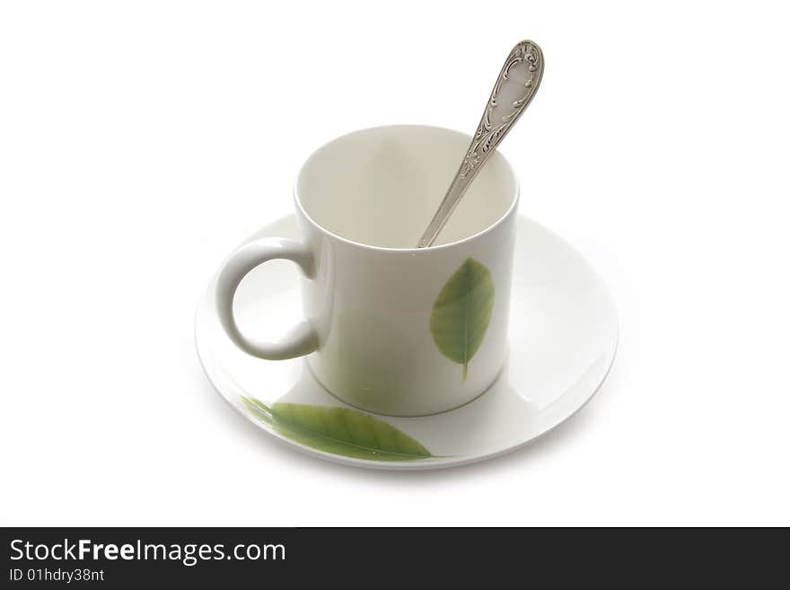 White coffee cup with green leaf