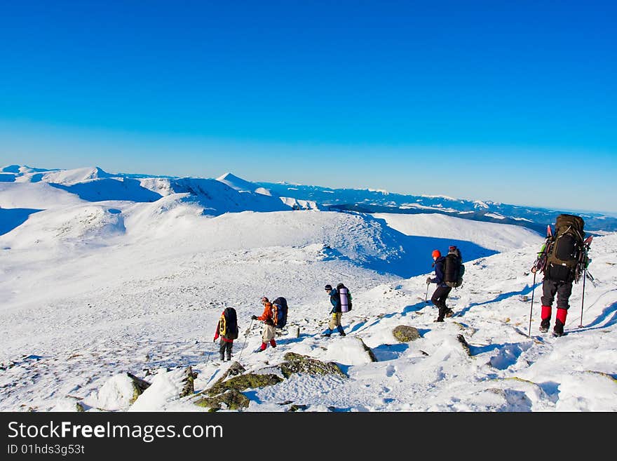 Hiker are in winter in mountains