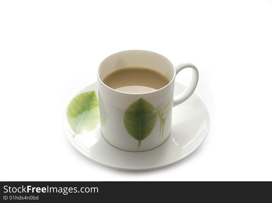 White coffee cup with green leaf