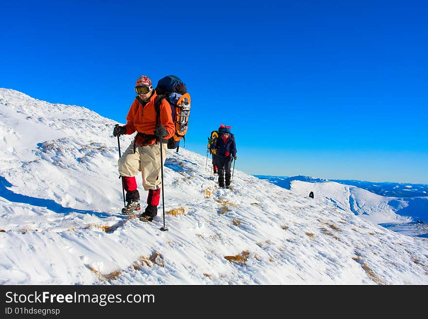 Hiker are in winter in mountains