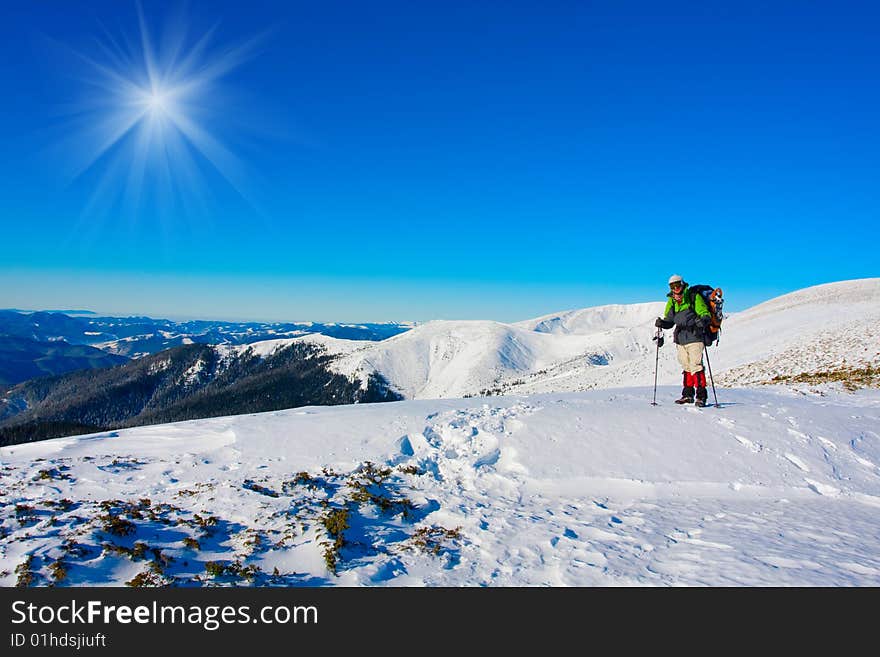 Hiker are in winter in mountains