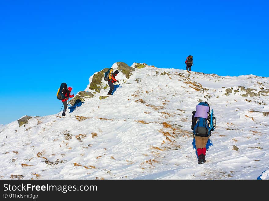 Hiker are in winter in mountains