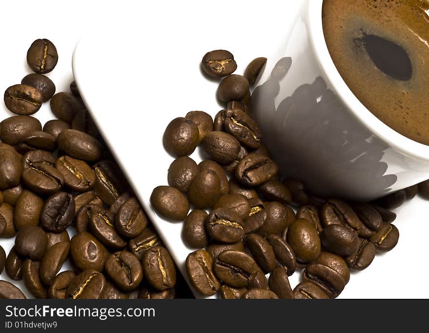 Cup of coffee with coffee grain on a white background