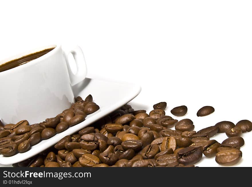 Cup of coffee with coffee grain on a white background