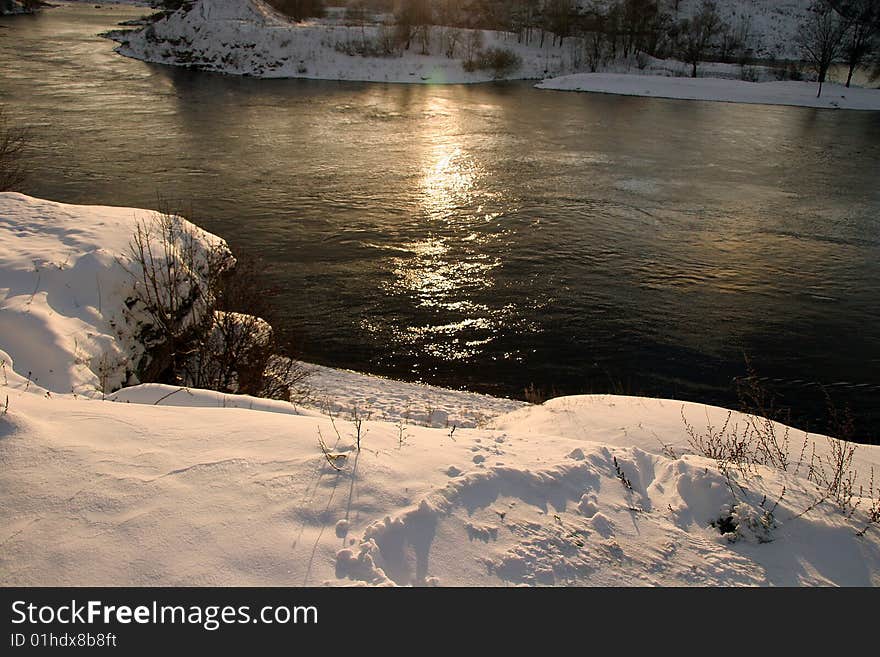 Beautiful winter landscape on the bank of the river