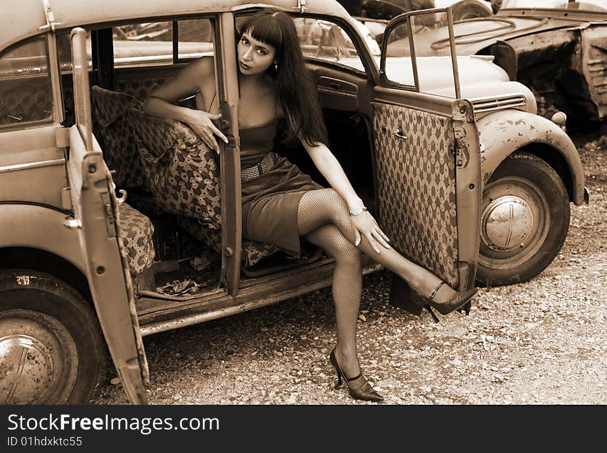 Lovely brunette in old car. Lovely brunette in old car