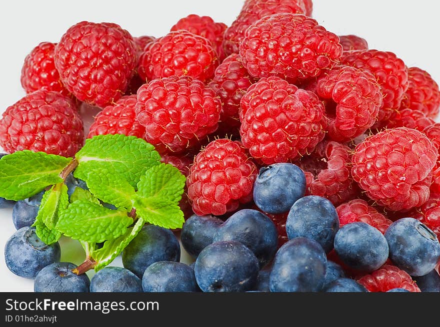 Blueberry and rasperry with mint leaves