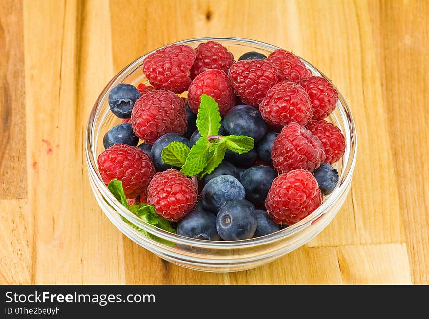 Blueberry, ruspberry and mint leaves