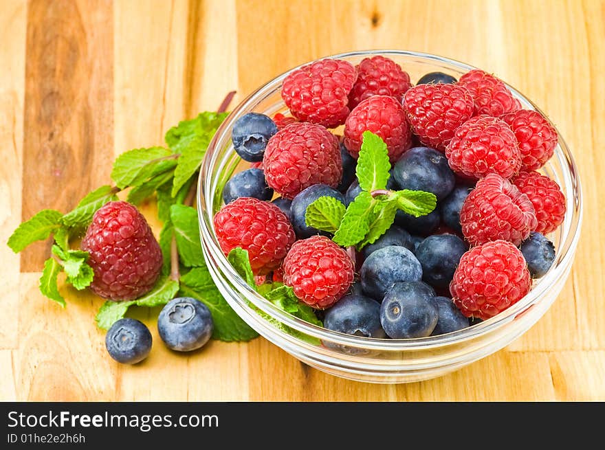 Blueberry, ruspberry and mint leaves