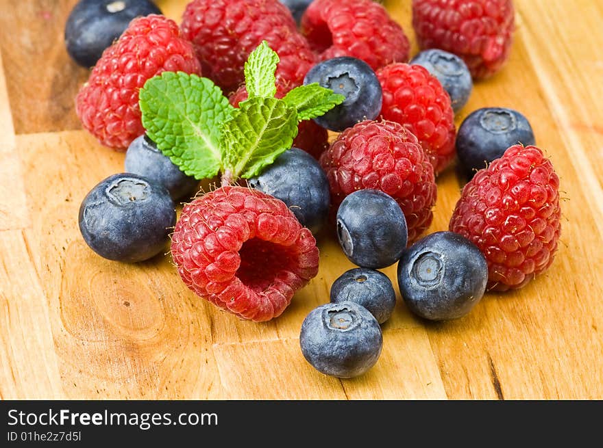 Blueberry and rasperry with mint leaves