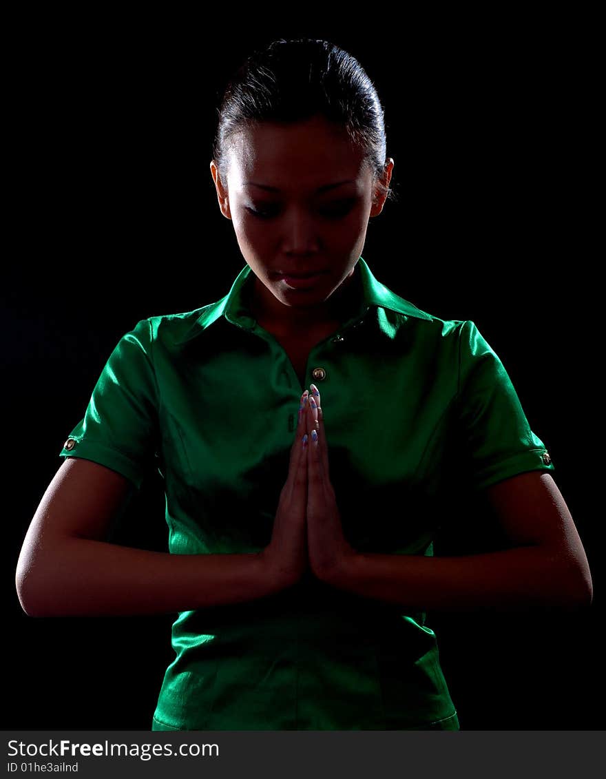 Portrait of a beautiful young woman in green shirt