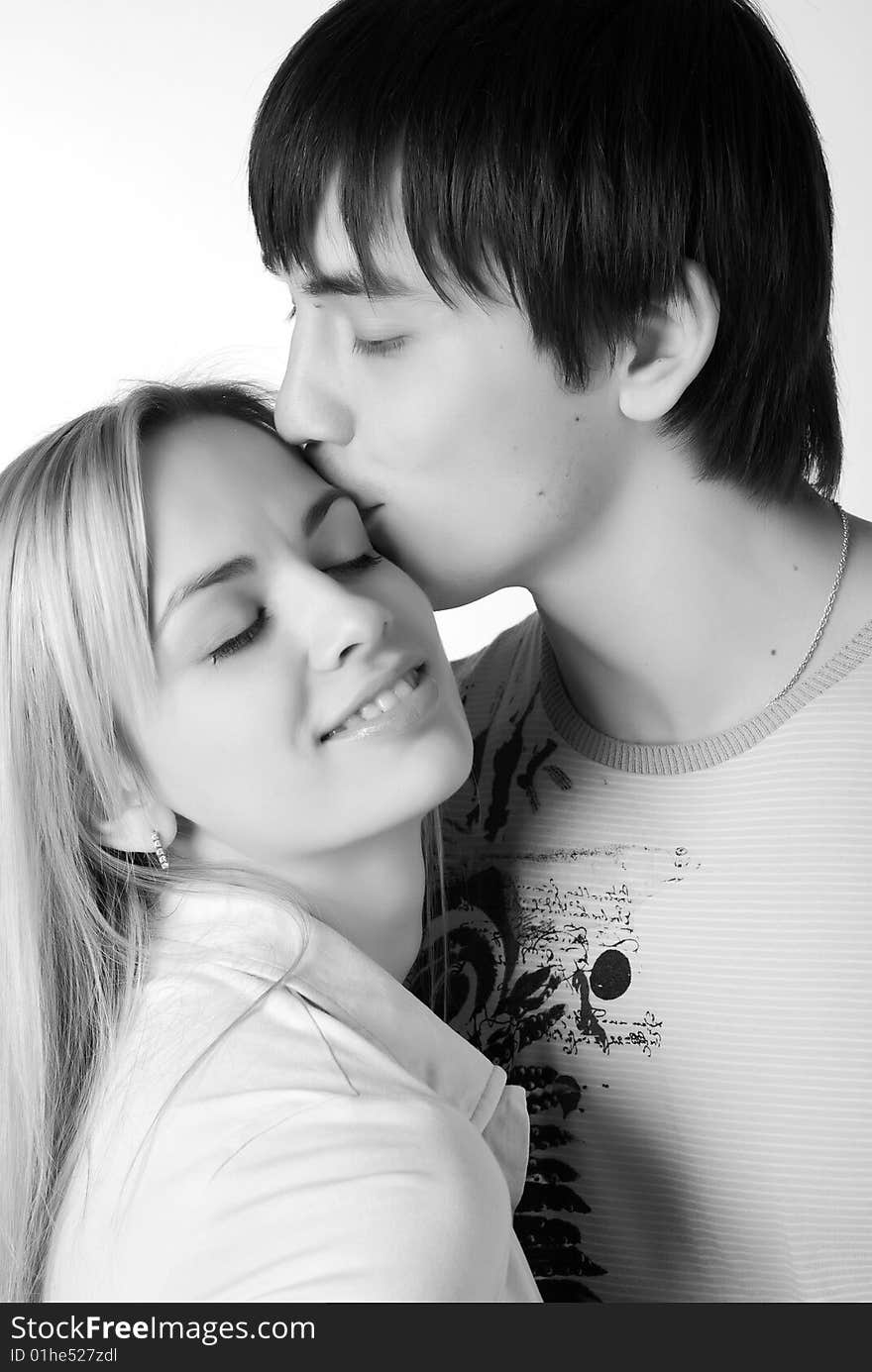 Young loving couple isolated at white background