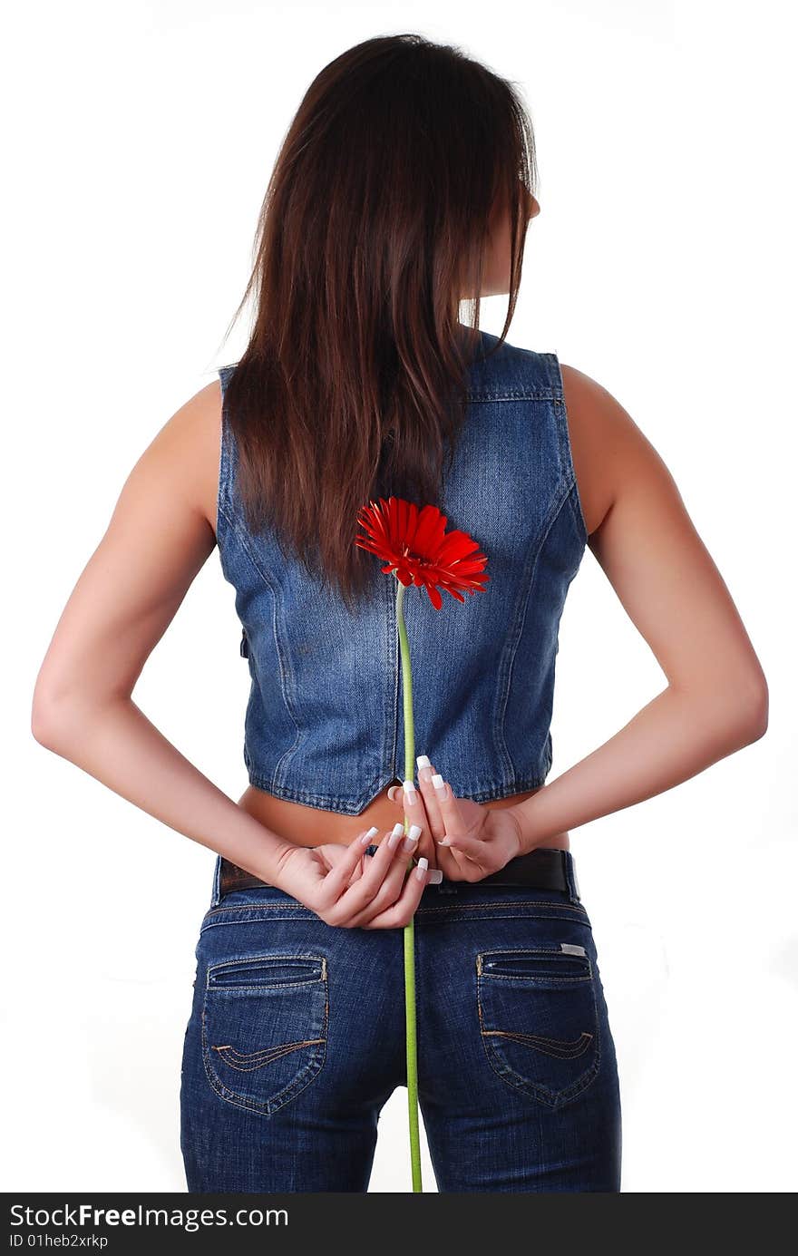 Portrait of a beautiful woman in jeans wear with flower. Portrait of a beautiful woman in jeans wear with flower