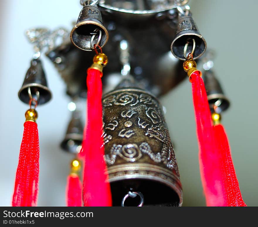 Old chinese bronze bell with dragons and hieroglyphs - on defocused (blurred) background. Old chinese bronze bell with dragons and hieroglyphs - on defocused (blurred) background.