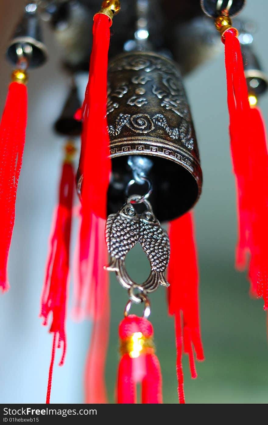 Old chinese bronze bell with dragons and hieroglyphs - on defocused (blurred) background. Old chinese bronze bell with dragons and hieroglyphs - on defocused (blurred) background.