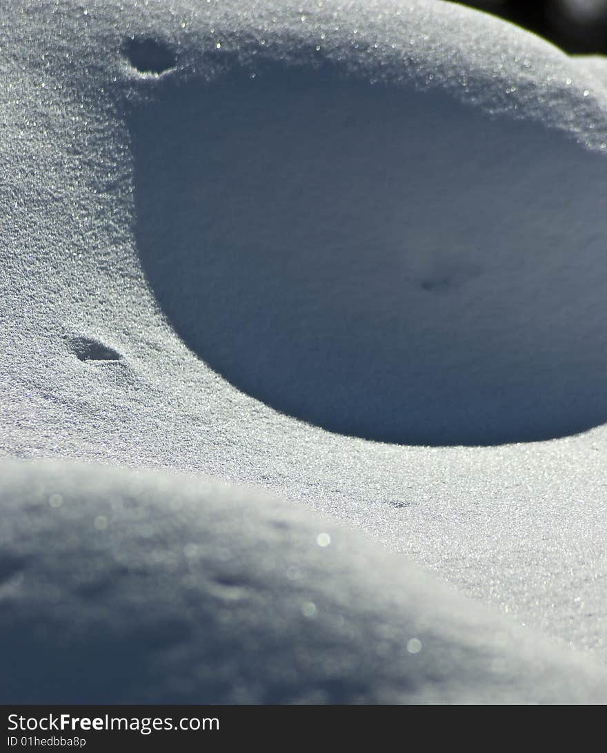 Curious shapes made in the snow by contrast, shadow and form. Curious shapes made in the snow by contrast, shadow and form