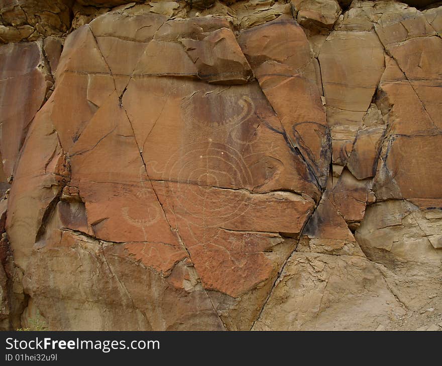 Weather worn indian petroglyphs in central Wyoming near Thermopolis. Weather worn indian petroglyphs in central Wyoming near Thermopolis.