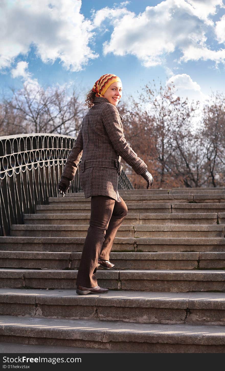 Beauty girl on stone ladder