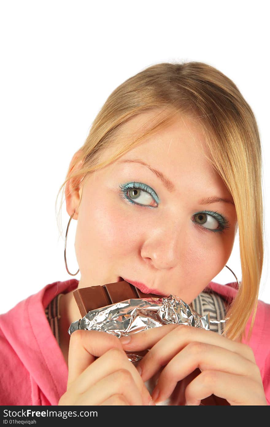 Young girl eats chocolate on white background. Young girl eats chocolate on white background