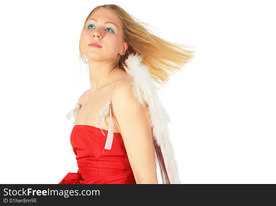 Blonde girl in red dress and angel's wings on white background