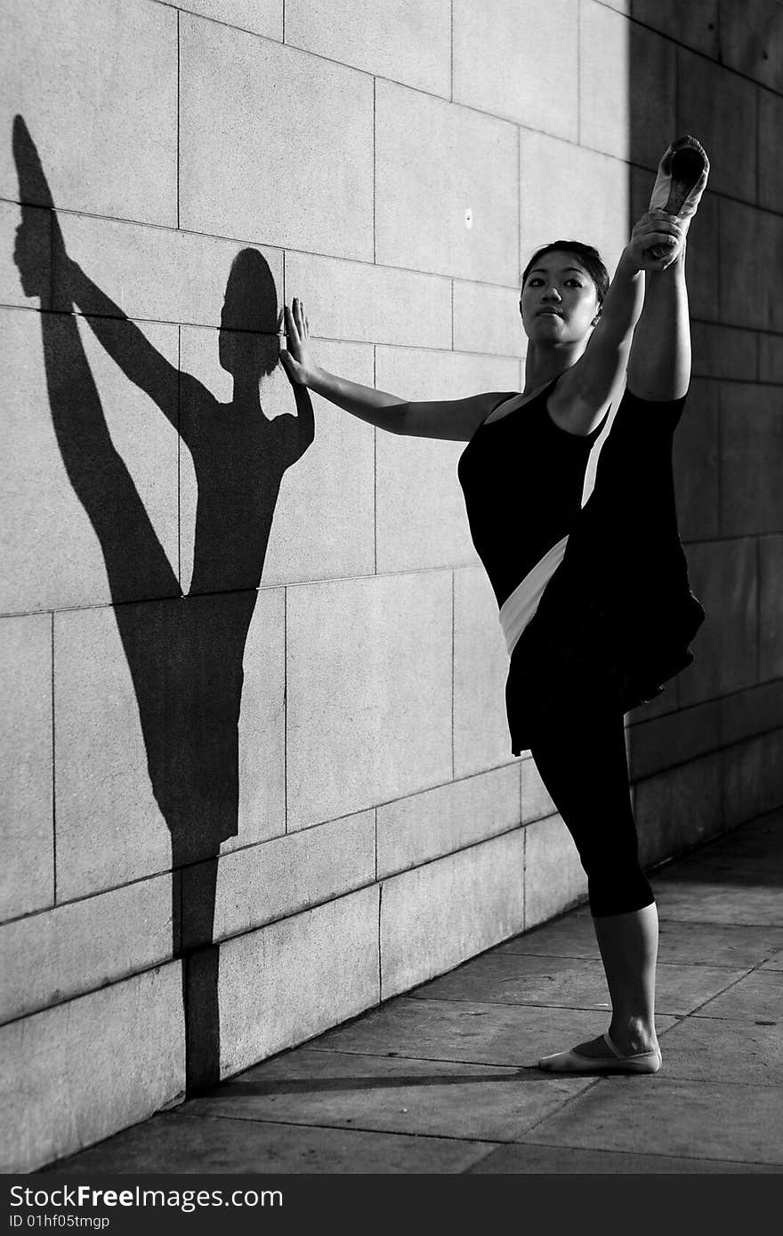 A female dancer dancing in the outdoors. A female dancer dancing in the outdoors