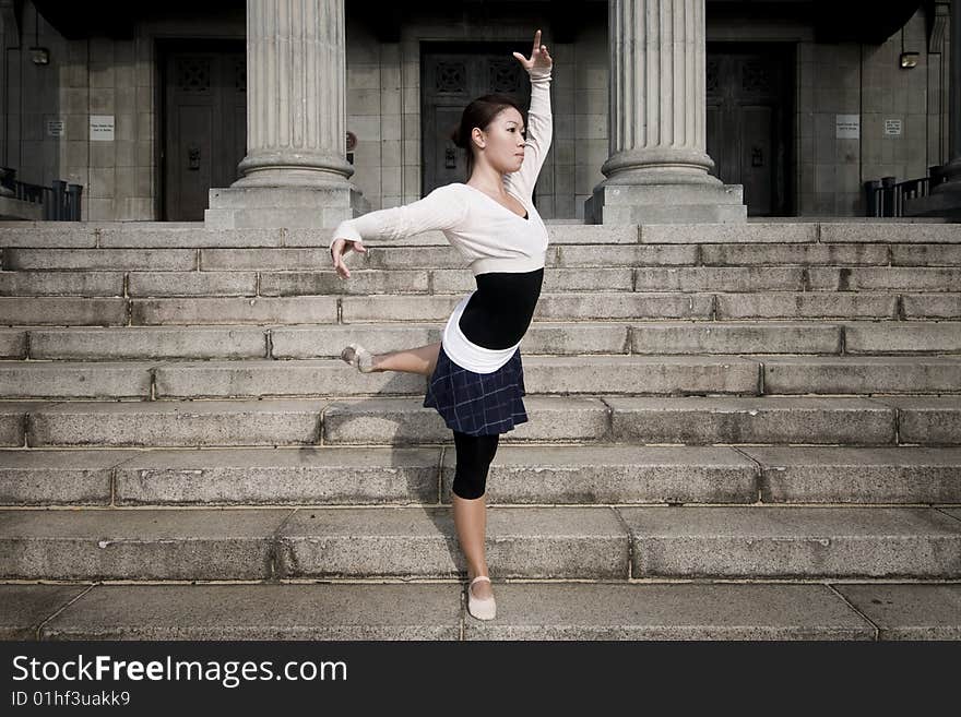 A female dancer dancing in the outdoors. A female dancer dancing in the outdoors