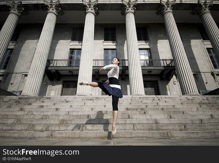 A female dancer dancing in the outdoors. A female dancer dancing in the outdoors