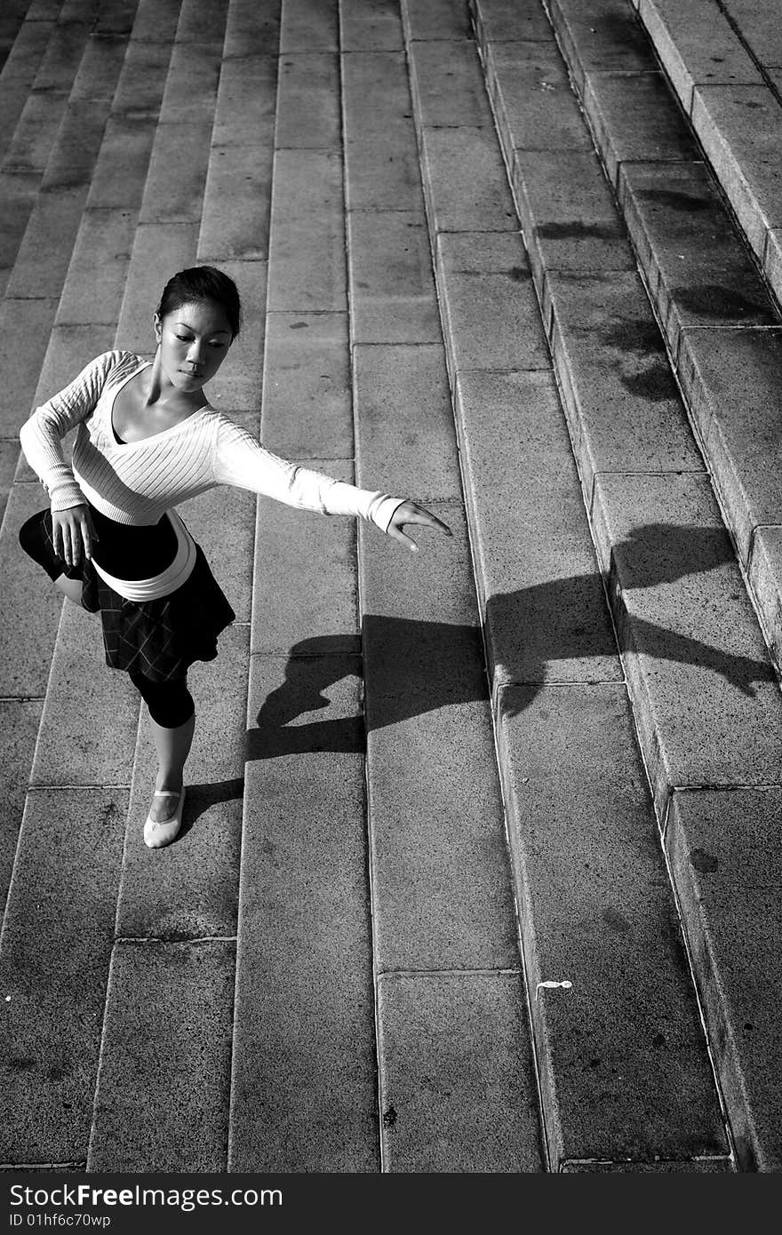 A female dancer dancing in the outdoors. A female dancer dancing in the outdoors