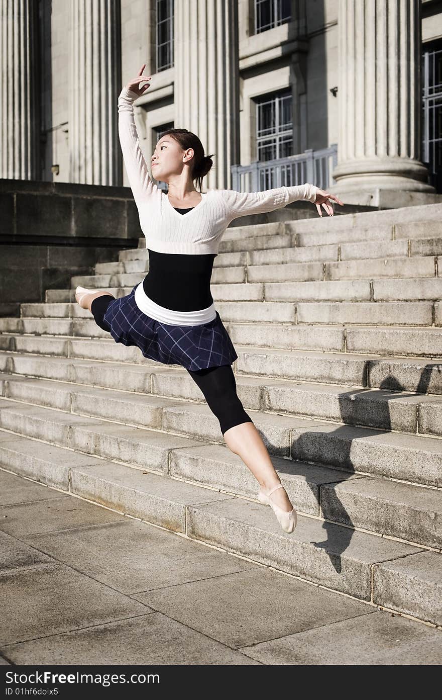 A female dancer dancing in the outdoors. A female dancer dancing in the outdoors