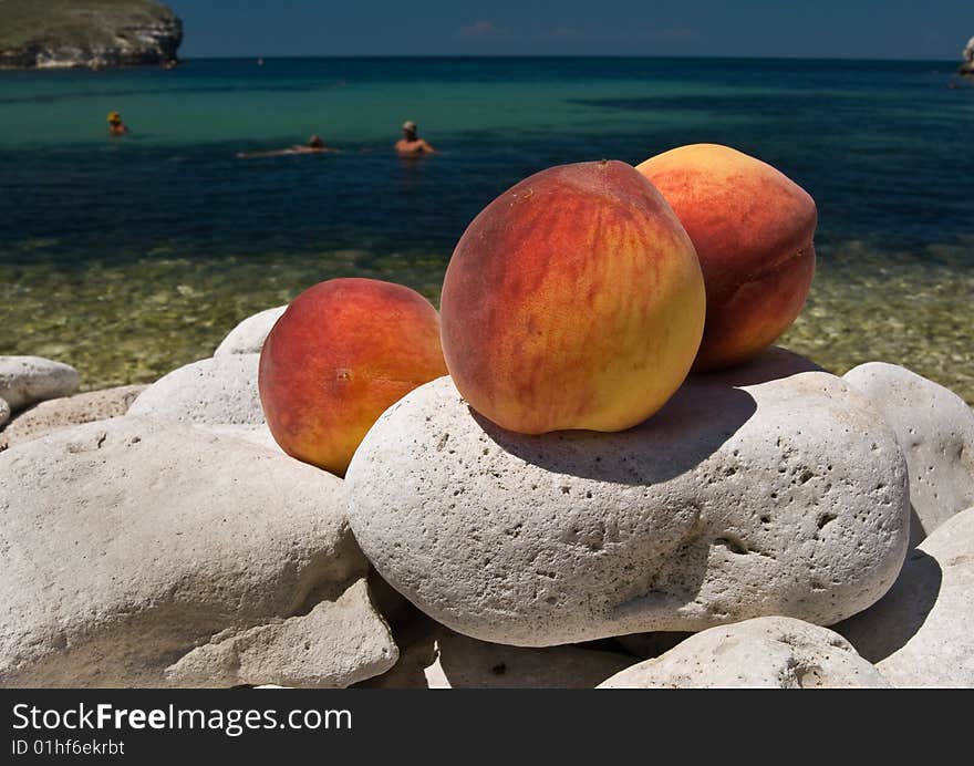 Juicy Peaches on sea  background