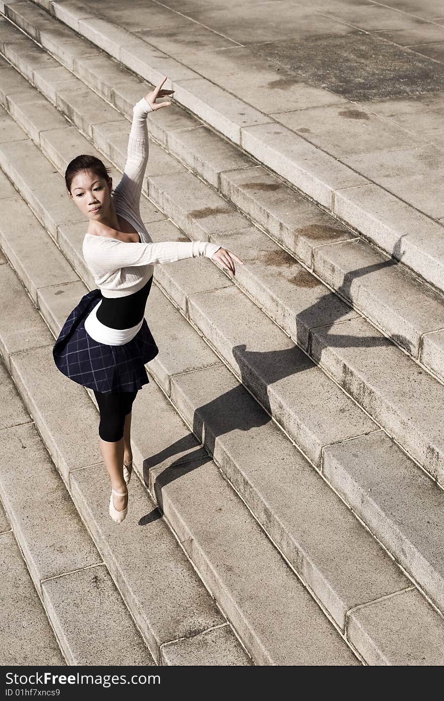 A female dancer dancing in the outdoors. A female dancer dancing in the outdoors