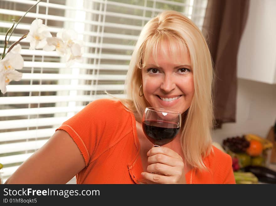 Attractive Blond With A Glass Of Wine