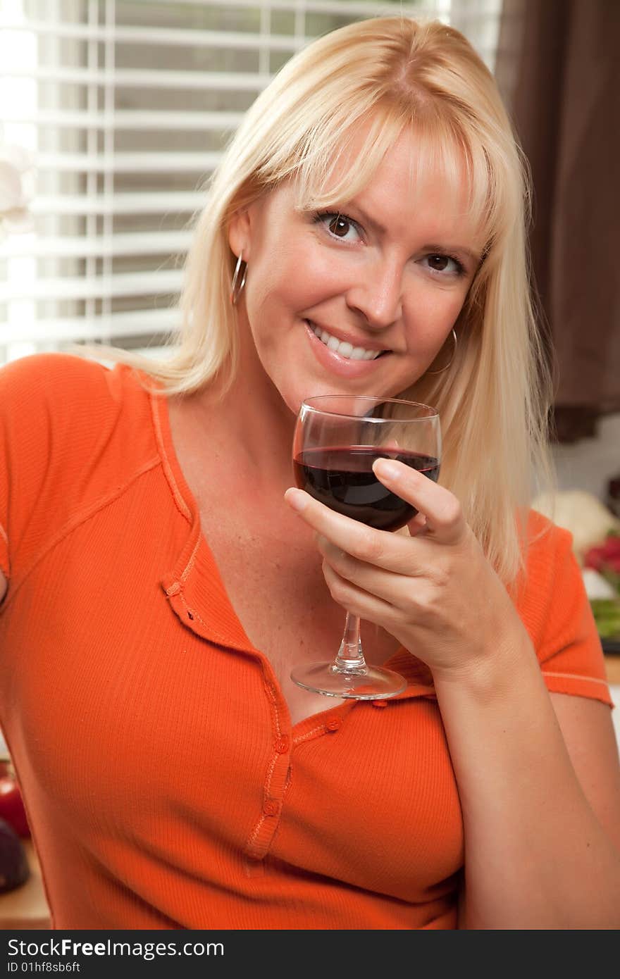 Attractive Blond with a Glass of Wine