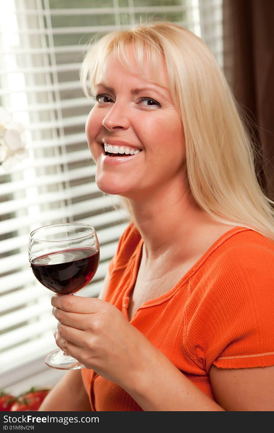 Attractive Blond With A Glass Of Wine