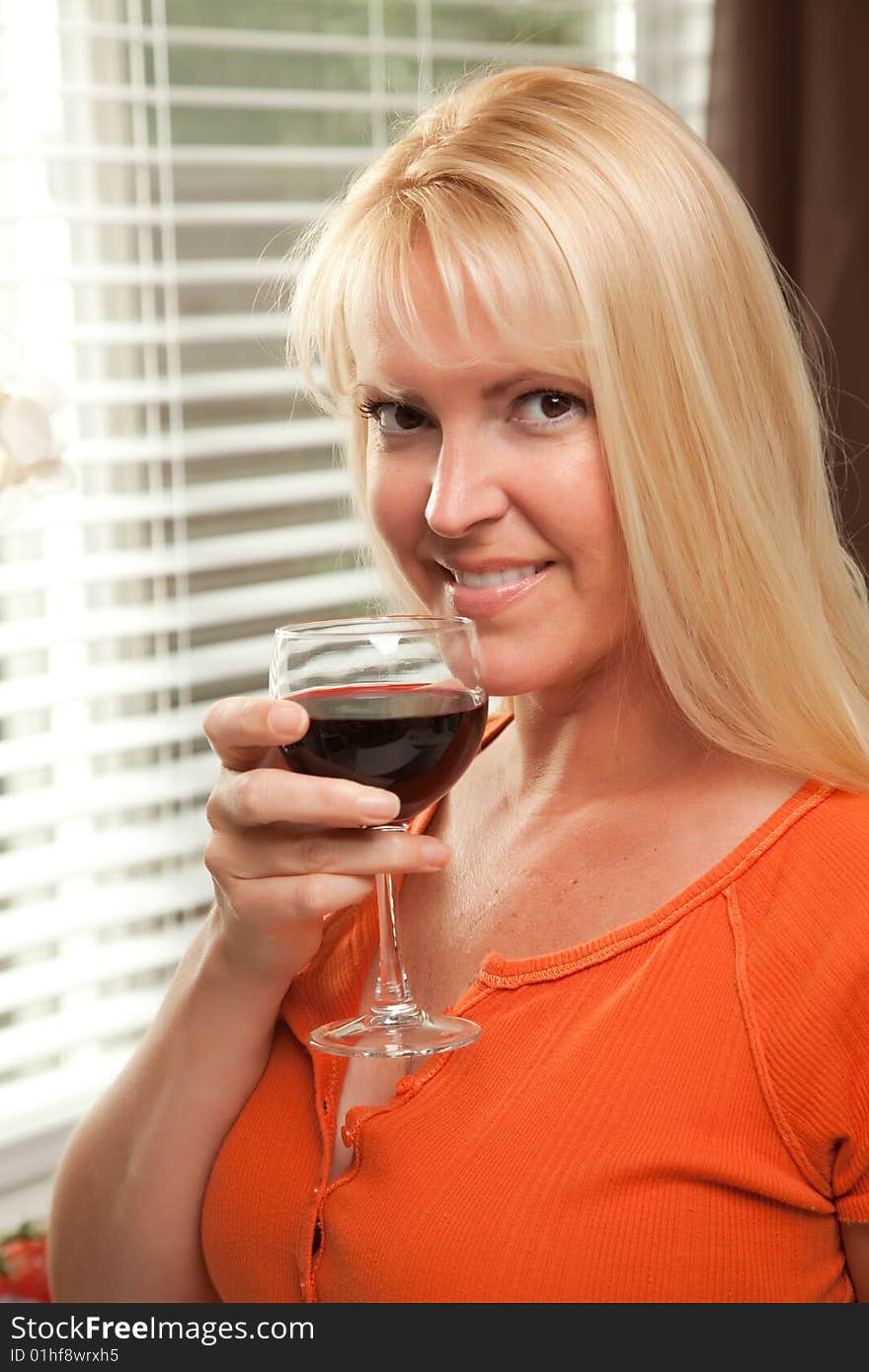 Attractive Blond With A Glass Of Wine