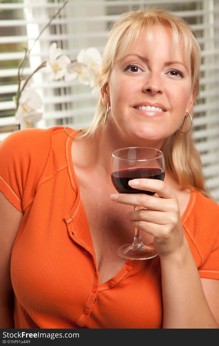 Attractive Blond With A Glass Of Wine