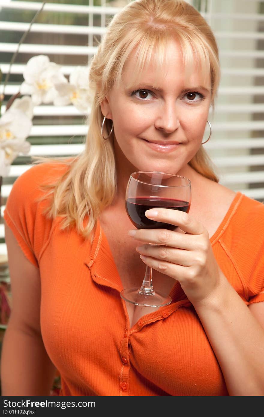 Attractive Blond with a Glass of Wine