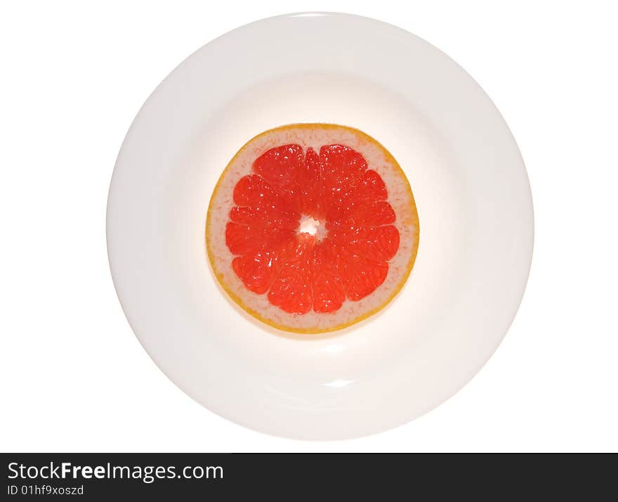 Grapefruit on dish isolated on white