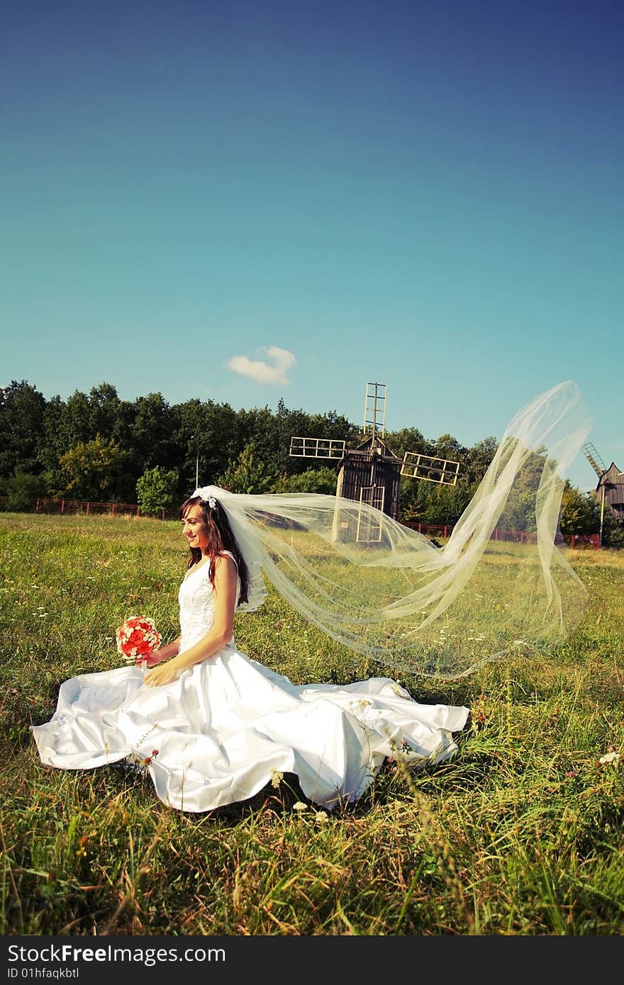 Happy bride with a wedding bouquet