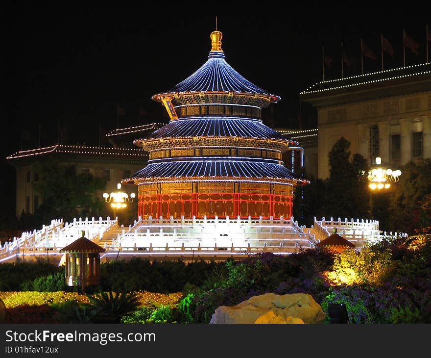 It is a model for Temple of Heaven, a famous building in China, being used by Chinese emperors to pray for their country. The outside was made by colorful lights and I took it at night. It was build in October 2007 to celebrate our National Day.