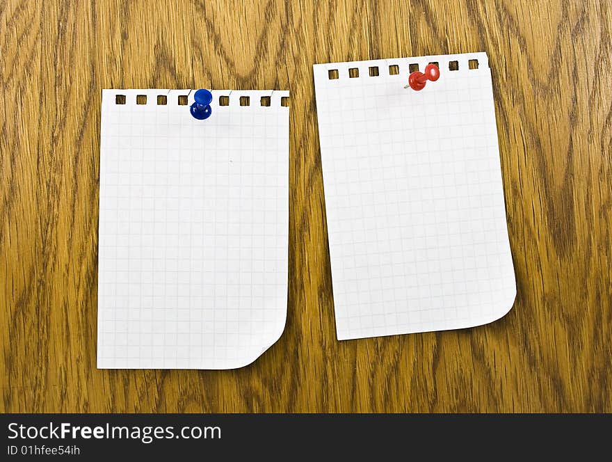 Reminders notes with pins on wooden background