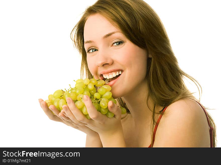 Portrait of a cheerful young beautiful woman eating grapes. Portrait of a cheerful young beautiful woman eating grapes