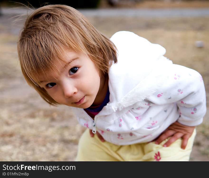 A baby-girl inspecting her photographer/grandfather's camera. A baby-girl inspecting her photographer/grandfather's camera