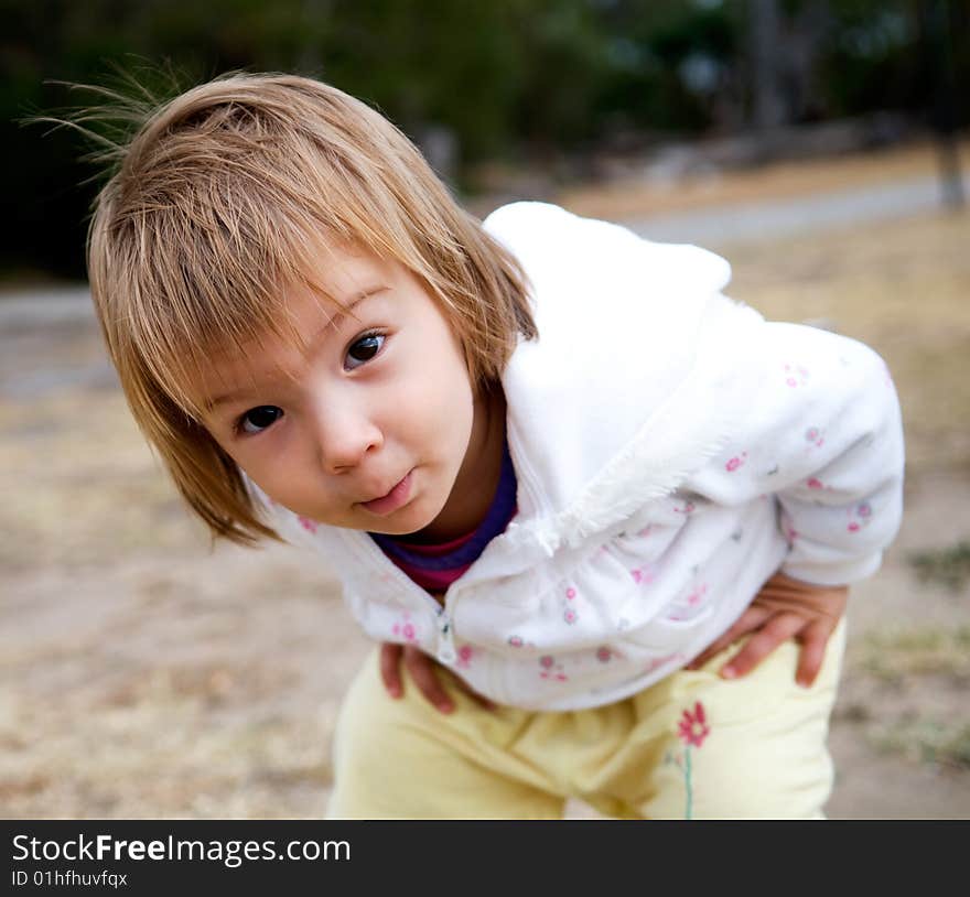 A baby-girl inspecting her photographer/grandfather's camera. A baby-girl inspecting her photographer/grandfather's camera