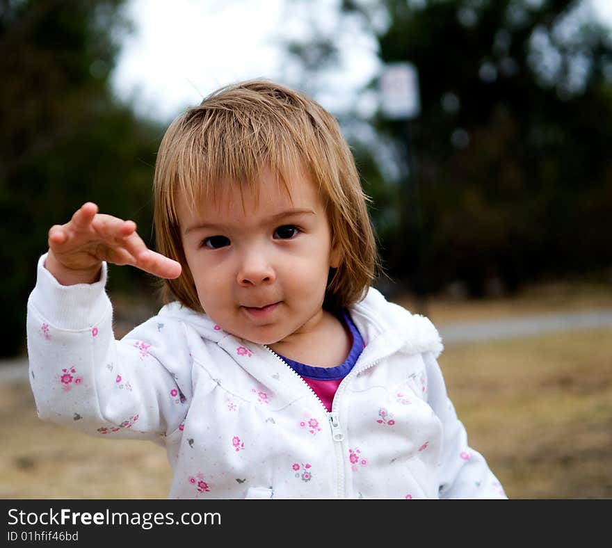 A baby-girl playing in a public park. A baby-girl playing in a public park