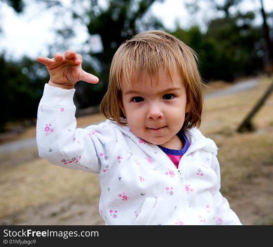 A baby-girl playing in a public park. A baby-girl playing in a public park