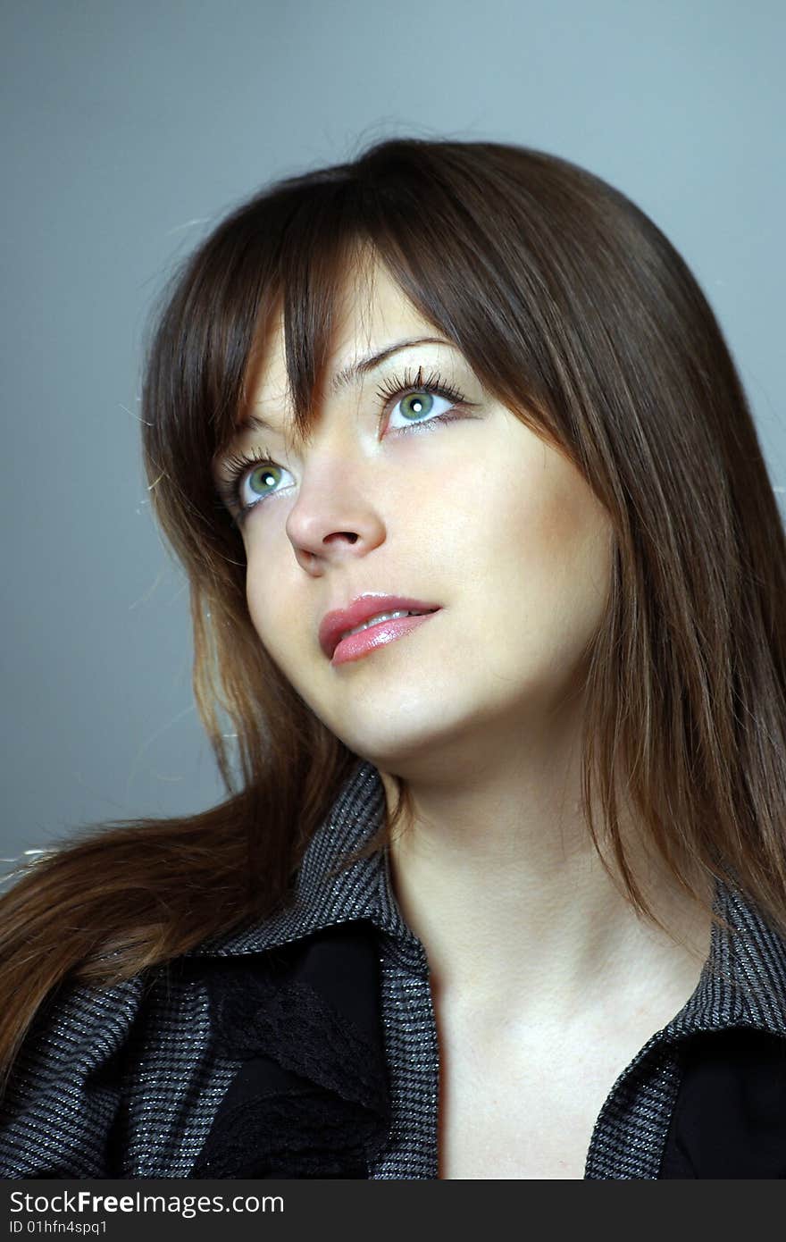 Young woman portrait on blue background